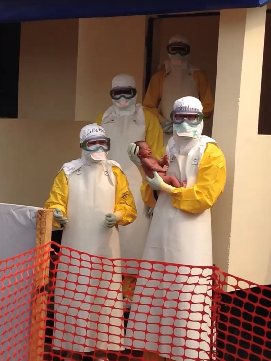 Doctors with newborn baby at an Ebola centre for pregnant women