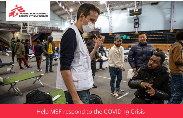 Doctor standing with a mask on in a temporary shelter "help msf respond to the COVID-19 crisis"