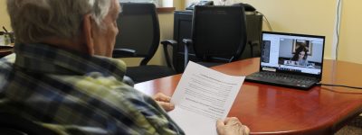 Resident preparing to speak at the online letter writing event