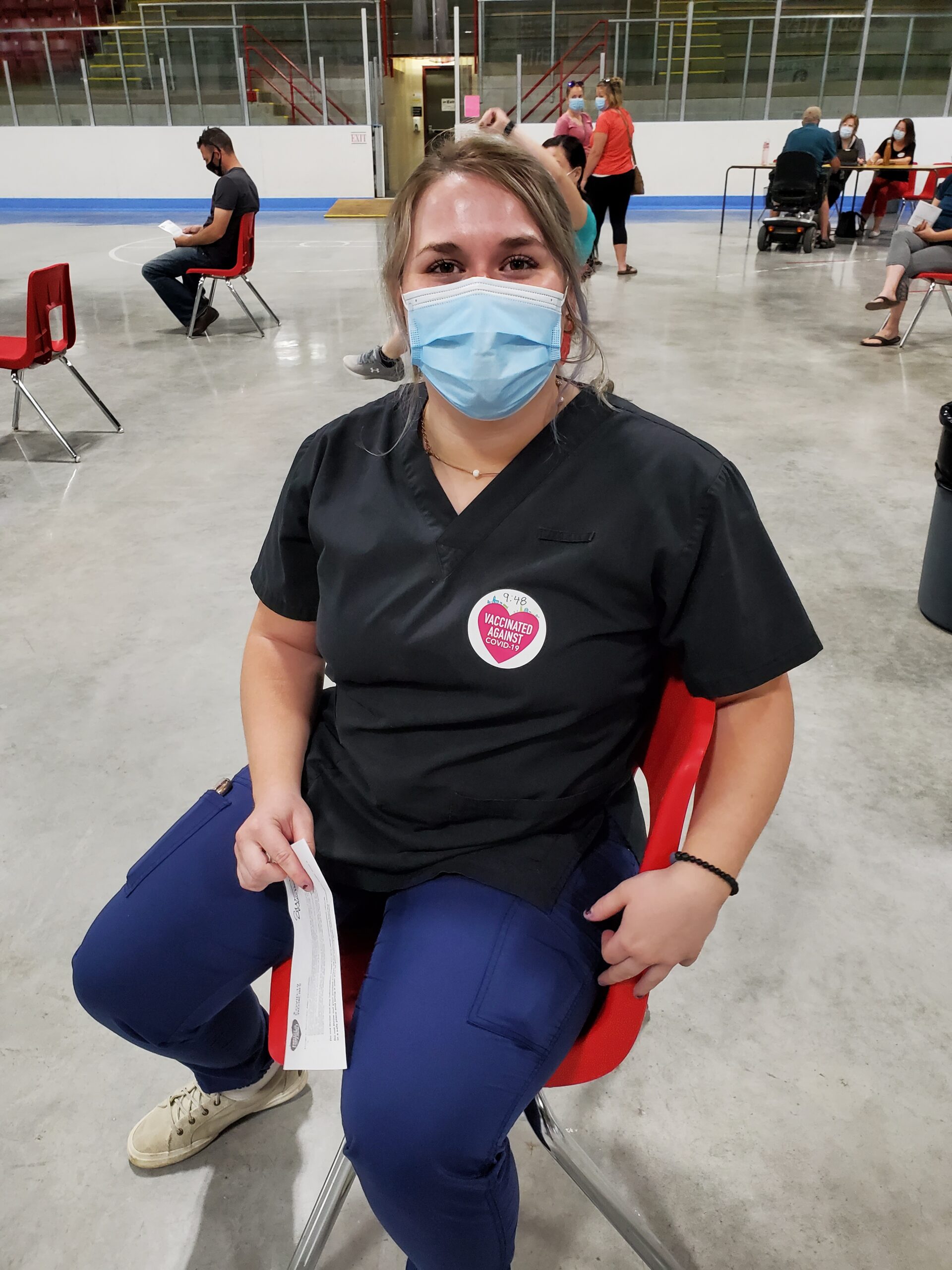 A long-term care home worker after just receiving her COVID-19 vaccine