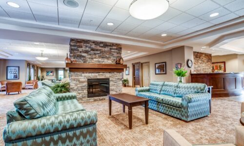 Seating area and fireplace at Oakcrossing Retirement Living