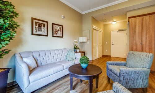 Seating area in studio suite at Oakcrossing Retirement Living