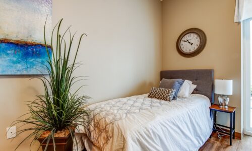 Bed in studio suite at Oakcrossing Retirement Living