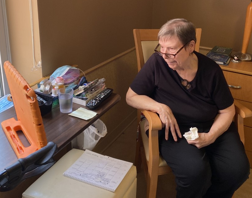 Eleanor, resident at peopleCare Hilltop Manor, chats with her pen pal over Skype