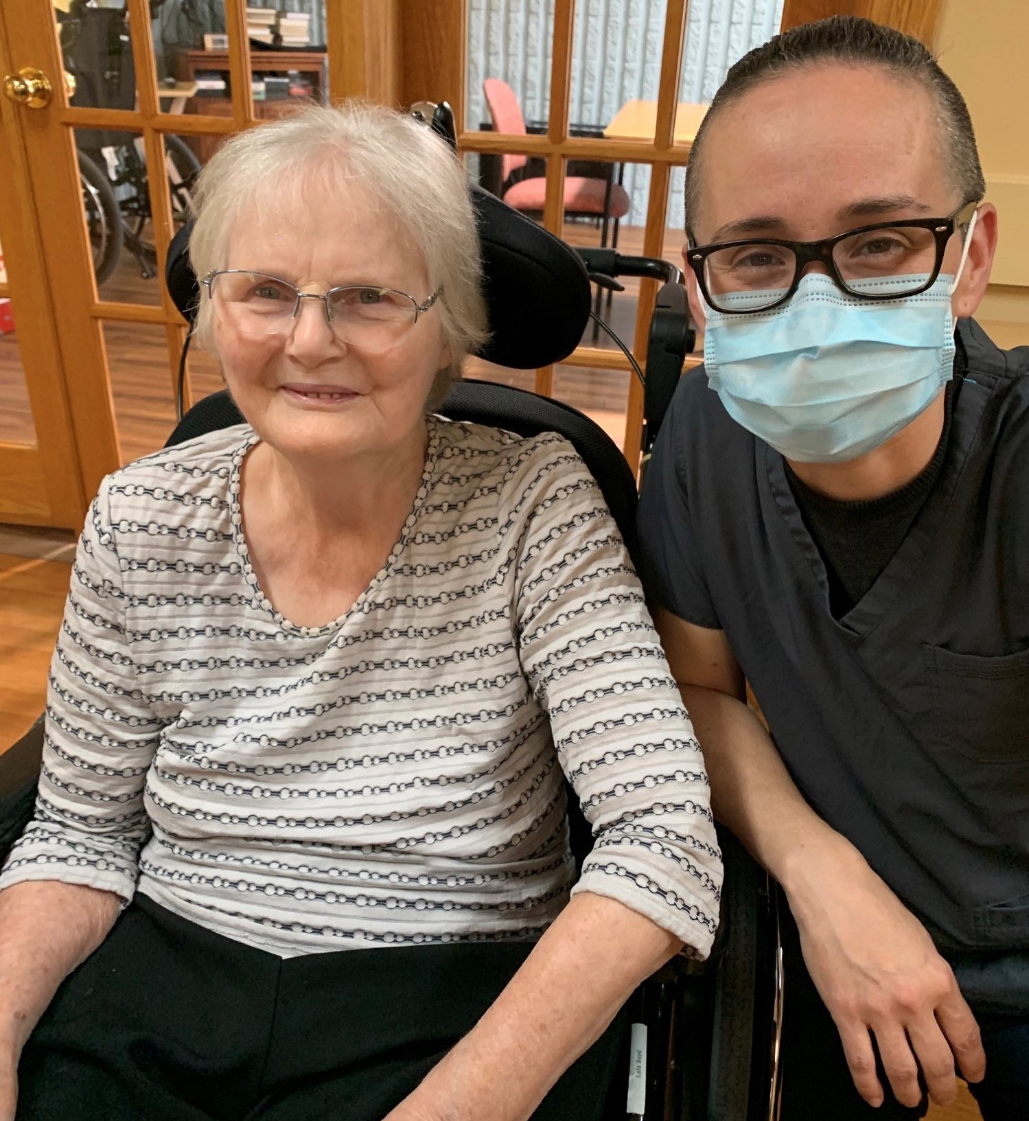 New PSW Denisse sitting next to a Meaford LTC resident