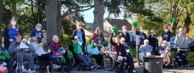 A group of residents and staff outside at peopleCare Tavistock