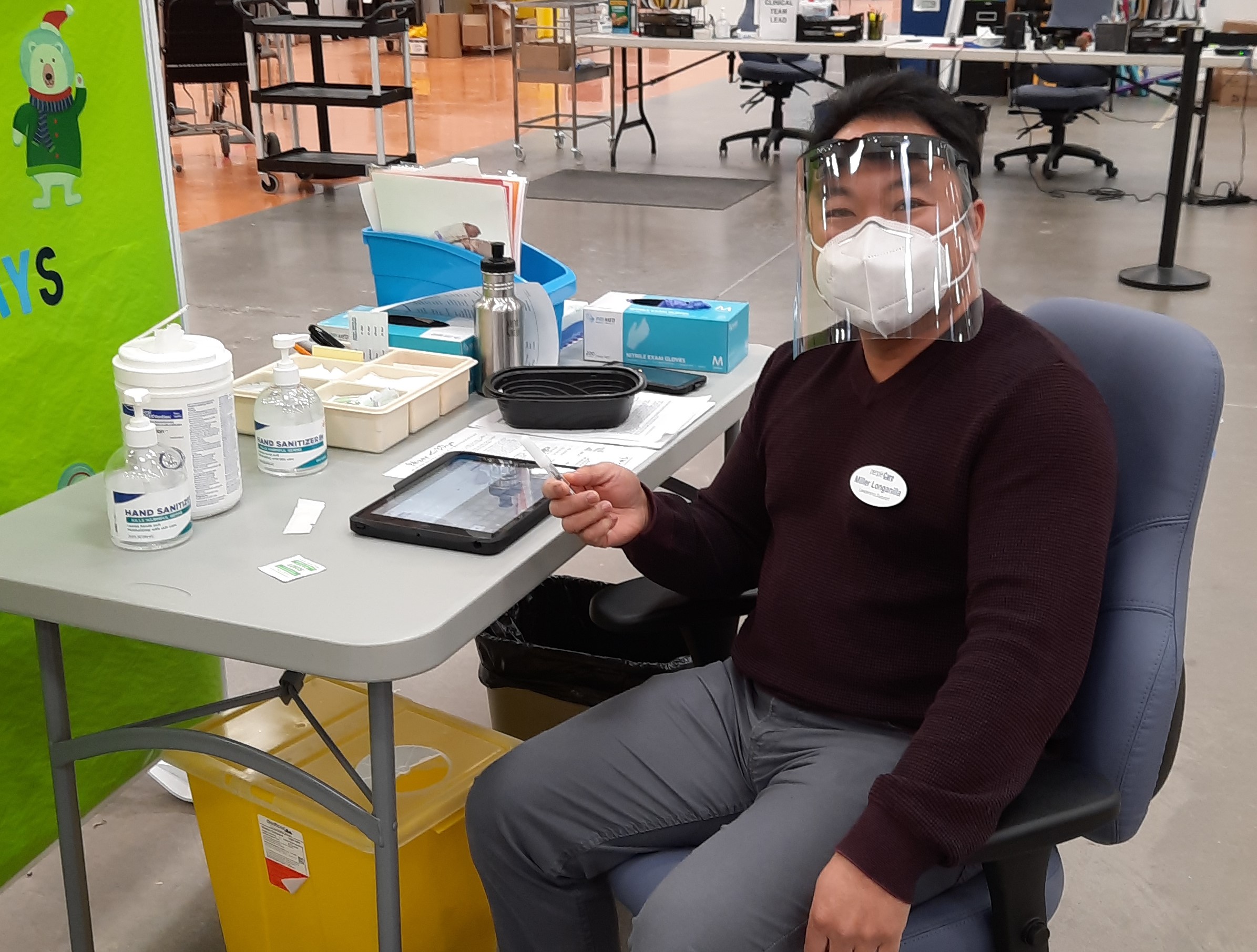 peopleCare team member working as a vaccinator at the Cambridge Pinebush clinic